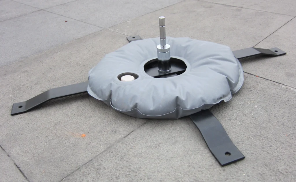 Cross Base used with a Water Weight Donut for use outside in windy situations.