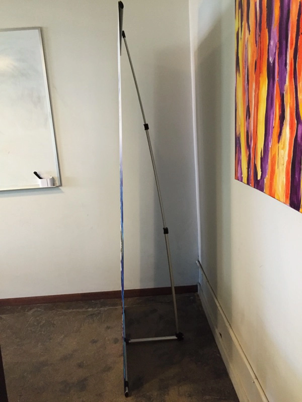 Side view of the sleek Ex-T Banner Stand hardware.