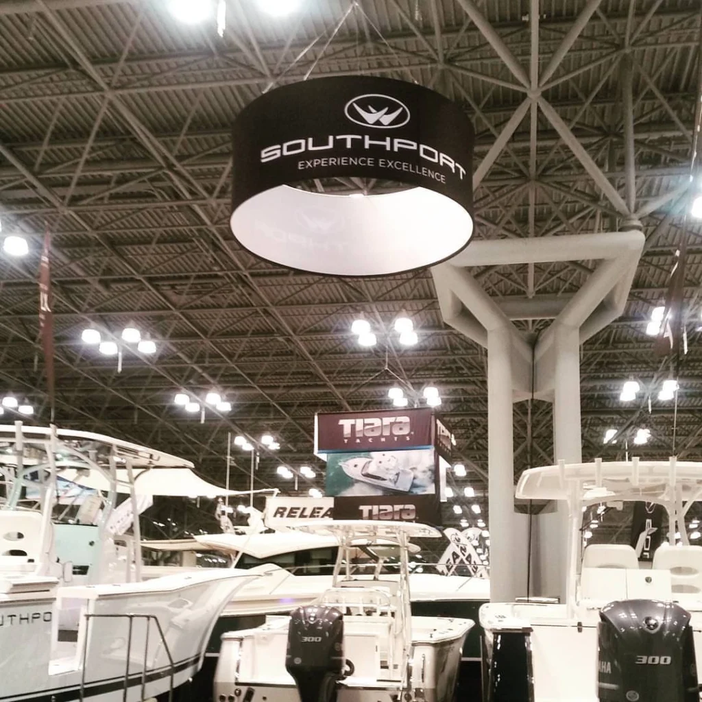 Circle Hanging Banner used over Southport Boats booth at boat show.