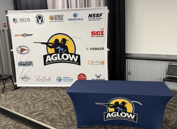 Stretch tablecloth and adjustable backwall used at AGLOW fishing event.
