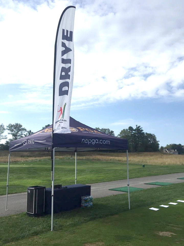 Wing banner and pop-up tent used at PGA golf event.